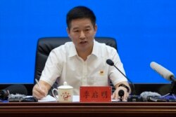 Ji Qiming, Asisten Direktur Badan Antariksa Berawak China , dalam konferensi pers Rabu (16/6). (AP)
