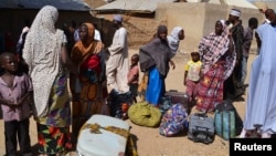 Families from Gwoza, Borno State, displaced by the violence and unrest caused by the insurgency, are pictured at a refugee camp in Mararaba Madagali, Adamawa State, Nigeria, Feb.18, 2014.