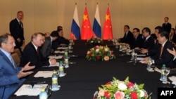 Talks in July between Russia's President Vladimir Putin, second from left, with his Chinese counterpart, Xi Jinping, right, in Fortaleza, Brazil, came as the two countries find an increasing number of areas of policy overlap. 