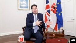 FILE - Chief Minister of Gibraltar, Fabian Picardo , speaks during an interview with The Associated Press in the British territory of Gibraltar, Feb. 28, 2017.