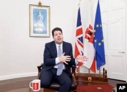Chief Minister of Gibraltar, Fabian Picardo , speaks during an interview with The Associated Press in No. 6 Convent Place, the seat of Gibraltar's government, in the British territory of Gibraltar, Feb. 28, 2017.