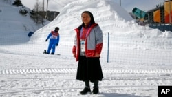 In this Feb. 12, 2018 photo, Sungsook Kim, a Catholic nun who goes by her religious name, Sister Droste, poses for a photograph at Phoenix Snow Park during the 2018 Winter Olympics in Pyeongchang, South Korea. Droste runs several centers spread across the sprawling Olympics venues to help sexual assault victims during the Winter Games.