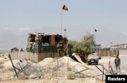 The Afghan National Army keeps watch at a check post in Chaparhar district of Nangarhar province, Afghanistan, May 24, 2017.