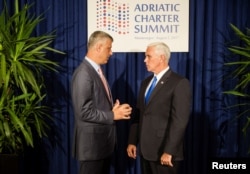 U.S. Vice President Mike Pence and Kosovo's President Hashim Thaci pose for a picture during the Adriatic Charter Summit in Podgorica, Montenegro, Aug. 2, 2017.