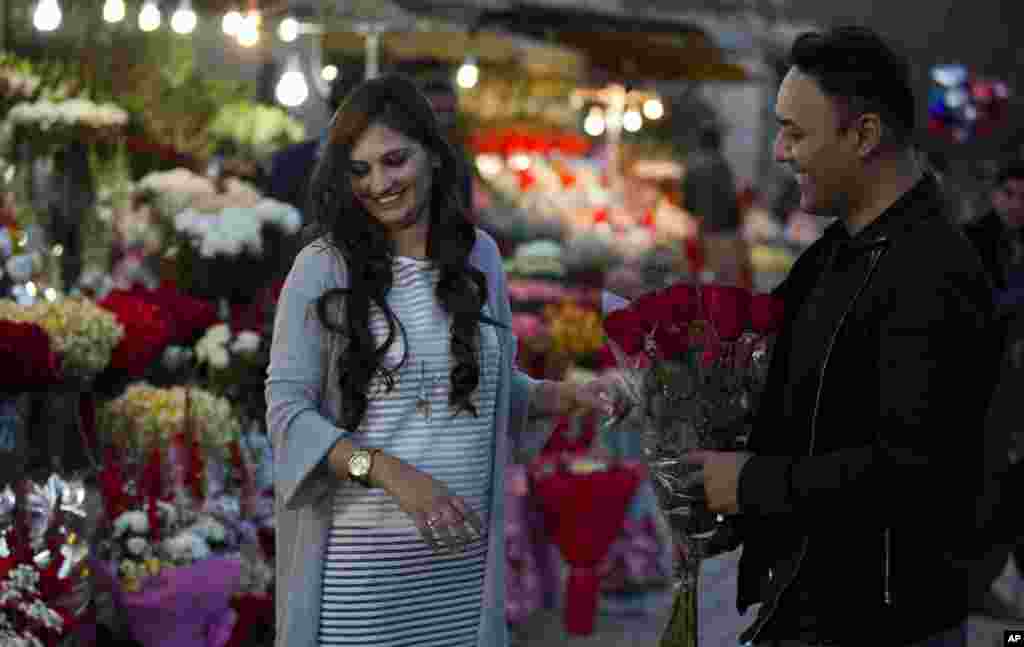 A couple buy flowers to celebrate Valentine&#39;s Day, in Islamabad, Pakistan. A judge has banned Valentine&#39;s Day celebrations in the country&#39;s capital, saying they are against Islamic teachings.