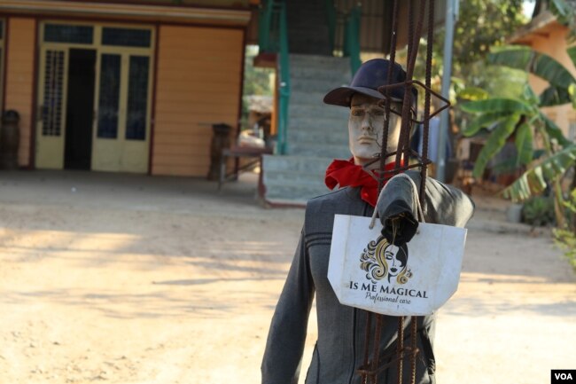 A scarecrow residents planted in front of their house in hope to ward off evil spirits in Kandal province, Cambodia. (Sun Narin/VOA Khmer)