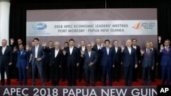 Leaders pose for a family photo at the APEC 2018 Economic Leaders Meeting at the APEC Haus at Port Moresby, Papua New Guinea, Nov. 18, 2018.