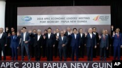 Leaders pose for a family photo at the APEC 2018 Economic Leaders Meeting at the APEC Haus at Port Moresby, Papua New Guinea, Nov. 18, 2018.