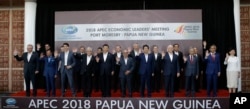 Leaders pose for a family photo at the APEC 2018 Economic Leaders Meeting at the APEC Haus at Port Moresby, Papua New Guinea, Nov. 18, 2018.