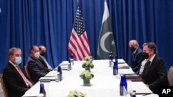 FILE - Pakistani Foreign Minister Shah Mahmood Qureshi, left, meets with US Secretary of State Antony Blinken, right, on the sidelines of the 76th UN General Assembly, Sept. 23, 2021, in New York.