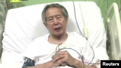 FILE - Peru's former President Alberto Fujimori asks for forgiveness from Peruvians as he lies in hospital bed in Lima, Peru, in this still image taken from a video posted on Facebook on Dec. 26, 2017.