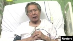 Peru's former President Alberto Fujimori asks for forgiveness from Peruvians as he lies in hospital bed in Lima, Peru, in this still image taken from a video posted on Facebook on Dec. 26, 2017. He was hospitalized again on April 17, 2022.