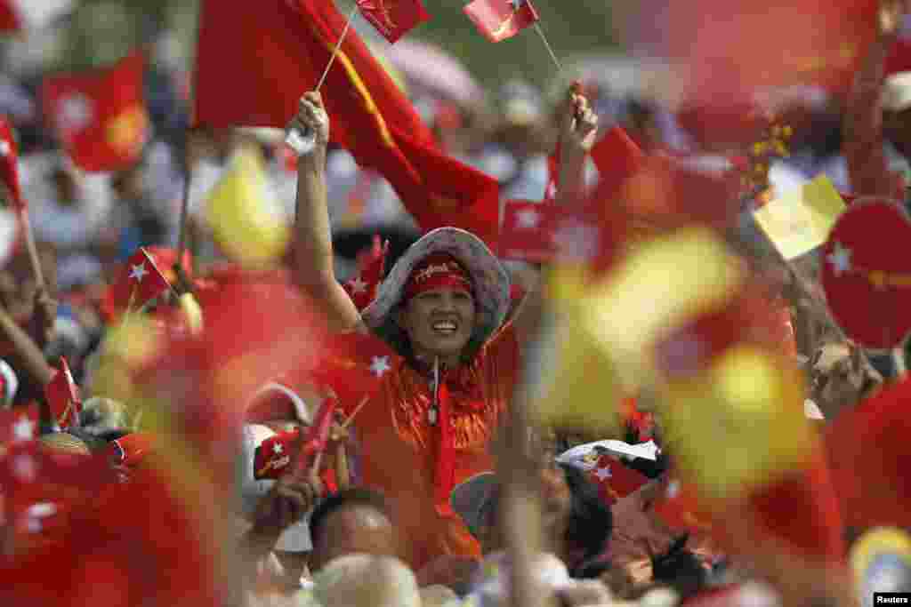 Supporters attend a speech by Burma's pro-democracy leader Aung San Suu Kyi calling for the amendment of the 2008 Constitution at a rally in Aungpinlae Stadium in Mandalay.