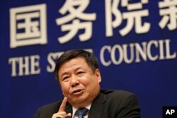 Chinese Finance Vice Minister Zhu Guangyao speaks during a press conference on Sino-US trade issues at the State Council Information Office in Beijing, April 4, 2018.