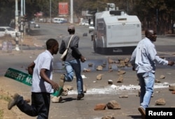 Opposition party supporters clash with police in Harare, Zimbabwe, Aug. 26, 2016.