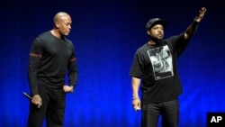 FILE - Los Angeles rap group N.W.A. members Dr. Dre, left, and Ice Cube join a quartet of 1970s-era FM radio rockers as inductees in the 2016 class at the Rock and Roll Hall of Fame, announced Dec. 17, 2015.