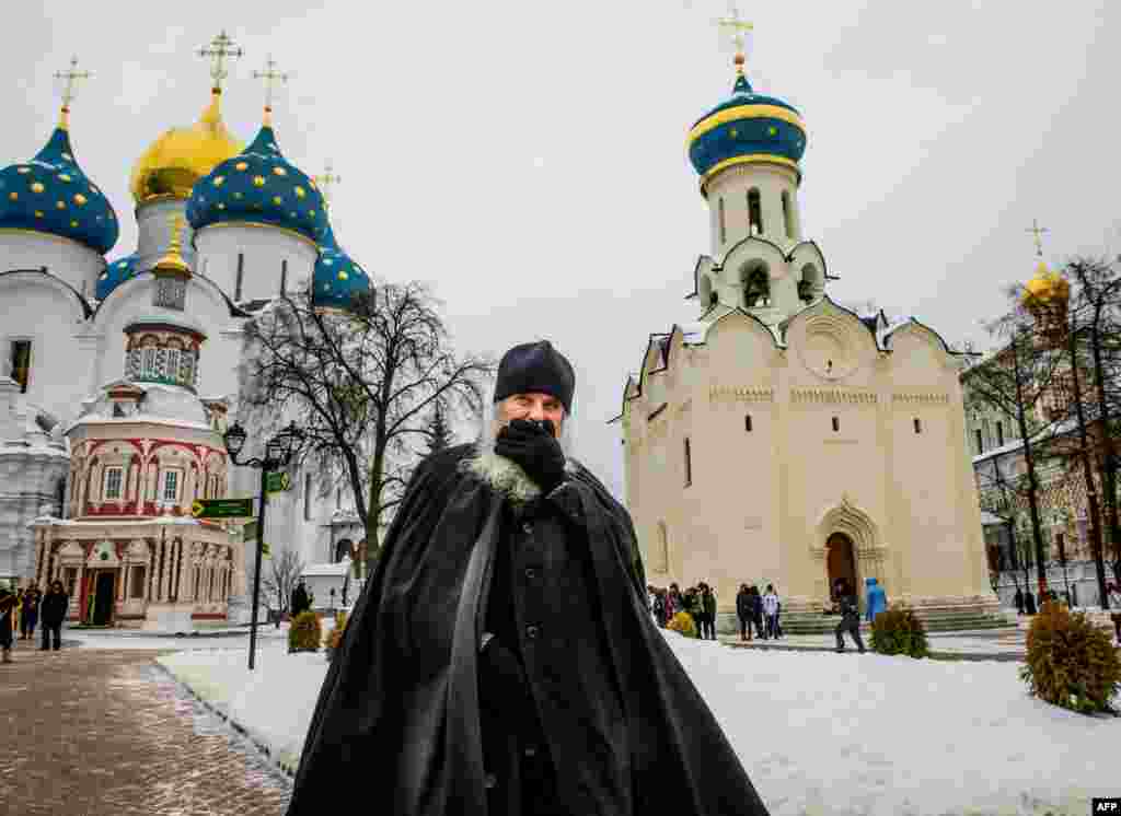 An Orthodox priest walks in the yard of The Holy Trinity-St.Sergius Lavra in Sergiyev Posad, Russia.