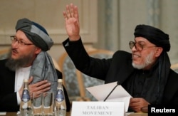 Sher Mohammad Abbas Stanakzai, right, head of the Taliban’s political council in Qatar, takes part in the multilateral peace talks on Afghanistan in Moscow, Nov. 9, 2018.
