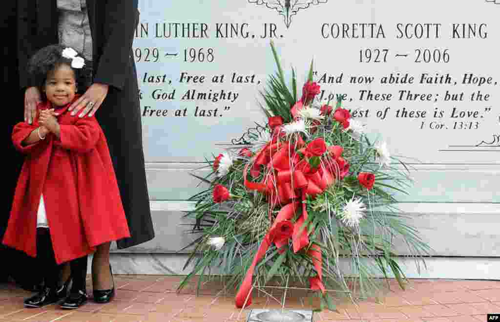 January 17: Two-year-old Yolanda Renee King stands at the crypt of her grandparents, slain civil rights leader Martin Luther King, Jr. and Coretta Scott King, during a wreath laying ceremony on the 25th anniversary of the King Holiday in Atlanta, Georgia.