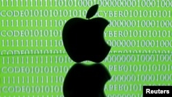 FILE - A 3-D printed Apple logo is seen in front of a displayed cyber code in this illustration taken Feb. 26, 2016. 