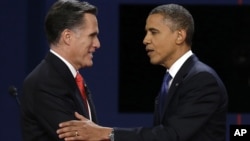 Republican presidential nominee Mitt Romney and President Barack Obama shake hands after the first presidential debate at the University of Denver, in Colorado, Oct. 3, 2012.p