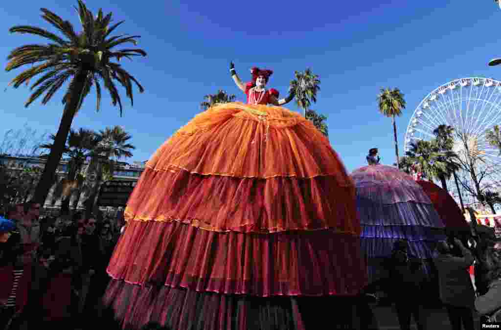 Artists wave to the crowd during a Carnival parade in Nice, France. The 131st Carnival of Nice will run up to March 1 and will celebrate the &quot;King of Music.&quot;