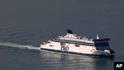 FILE - A P&O cross-channel ferry arrives at Calais harbour, northern France, Sept. 25, 2015. 
