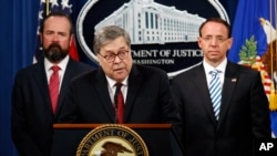 Attorney General William Barr speaks alongside Deputy Attorney General Rod Rosenstein, right, and acting Principal Associate Deputy Attorney General Edward O'Callaghan, left, about the release of a redacted version of special counsel Robert Mueller's repo