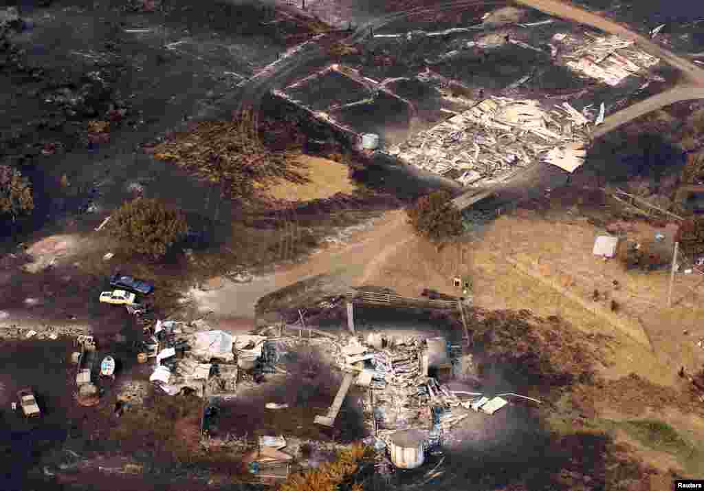2013年1月5日澳大利亞霍巴特以東的達納里地區被山火焚毀的住房。