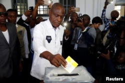 Martin Fayulu, Congolese joint opposition presidential candidate, casts his vote at a polling station in Kinshasa, Democratic Republic of Congo, Dec. 30, 2018.