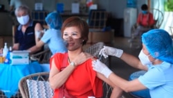 A woman receives a shot of the Moderna COVID-19 vaccine in Vung Tau, Vietnam, Monday, Sep. 13, 2021.