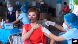 A woman receives a shot of the Moderna COVID-19 vaccine in Vung Tau, Vietnam, Monday, Sep. 13, 2021. (AP Photo/Hau Dinh)