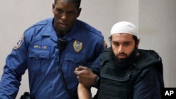 FILE - Ahmad Khan Rahimi, is led into court in Elizabeth, New Jersey, Dec. 20, 2016.