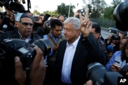 Presidential candidate Andres Manuel Lopez Obrador, of the MORENA party, arrives to a polling station during general elections in Mexico City, Mexico, July 1, 2018.