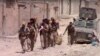 This frame grab from video released July 4, 2017, and provided by Furat FM, a Syrian Kurdish activist-run media group, shows U.S.-backed Syrian Democratic Forces fighters in the eastern side of Raqqa, Syria. The SDF forces have breached the wall around Raqqa's Old City, the U.S. military said.