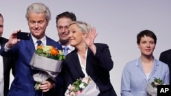 AfD (Alternative for Germany) chairwoman Frauke Petry, right, Far-right leader and candidate for next spring presidential elections Marine le Pen from France, center, and Dutch populist anti-Islam lawmaker Geert Wilders stand together after their speeches
