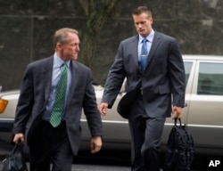 Former Blackwater Worldwide guard Evan Liberty, right, arrives at federal in Washington, June 11, 2014.