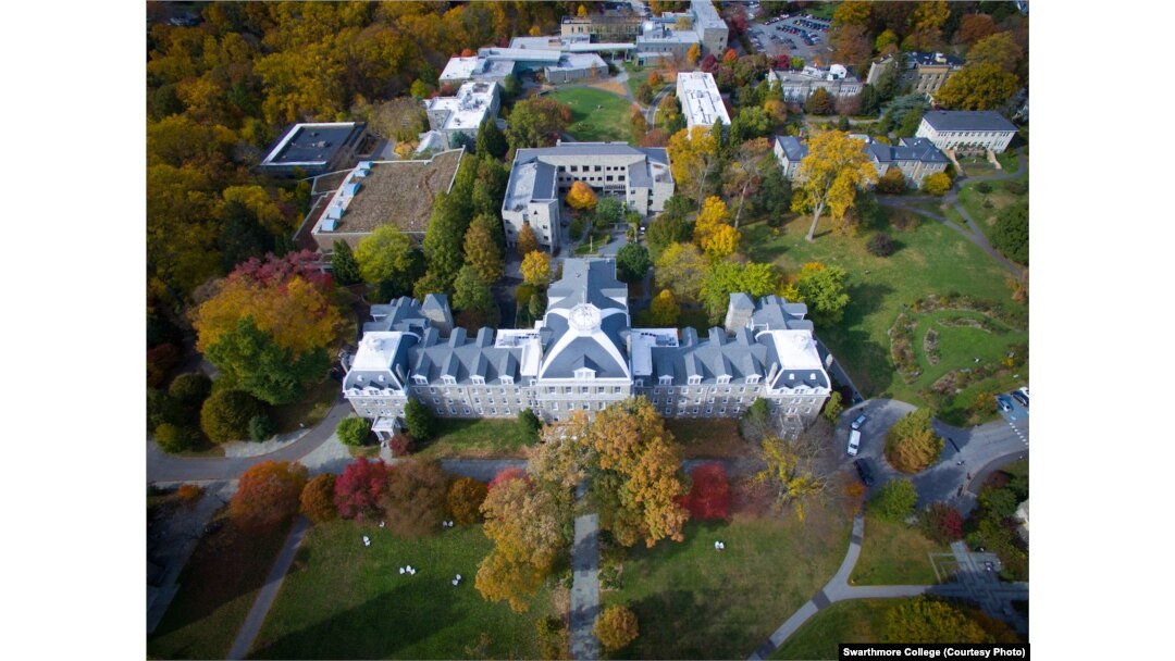 Aerial drone photography of the Swarthmore campus displaying the fall foliage and skyline