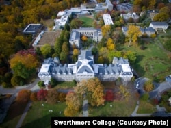 Aerial drone photography of the Swarthmore campus displaying the fall foliage and skyline