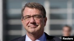 FILE - U.S. Defense Secretary Ash Carter, pictured during a visit to Jordan in July 2015, says Pyongyang's missile test shows the need to "build these missile defenses of various ranges to protect both our South Korean allies, U.S. forces on the Korean Peninsula, Japan and U.S. territory."
