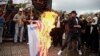 Palestinian demonstrators burn representations of Israeli and American flags during a protest against the possible U.S. decision to recognize Jerusalem as Israel's capital, in Gaza City, Dec. 6, 2017. 