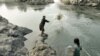 FILE - Fishing in the Mekong River below Khone Falls close to the Laos-Cambodian border. (Fletcher&Baylis/WWF- Greater Mekong)