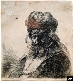 The etching by 17th century Dutch master, Rembrandt Van Rijn, was discovered by Very Rev. David M. O'Connell, C.M., president of The Catholic University of America, in a bathroom at CUA's Nugent Hall, which houses his office. Ed Pfueller/The Catholic Un