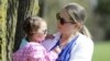 FILE - In this April 23, 2019 photo, Lisa Kum is seen in a park near Madison, Wis., with her daughter Emma, 2. In 2014, Kums husband Sothy Kum allowed an acquaintance to pay him to send marijuana to his house.