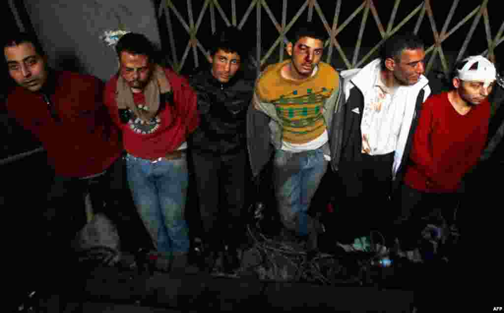 February 3: Pro-Mubarak supporters are detained by anti-government demonstators at an underground metro station after being rounded up during clashes. (Amr Abdallah Dalsh/Reuters)