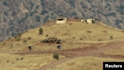 FILE - A tank is seen outside a Turkish military observation point in the mountains of the northern Iraqi region of Dohuk.