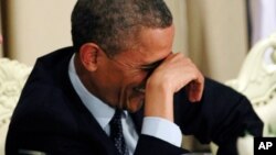 Barack Obama est en plein fou rire avec le ministre israélien Benjamin Netanyahu en mars 2013. 
