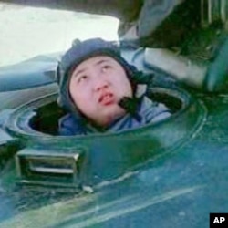 Kim Jong Un shown in documentary in the hatch of a KPA tank.