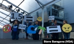 Members of the Australian Youth Climate Coalition demonstrate for increased climate funding at the U.N. summit in Paris.