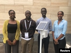 Four of the team members of Rwanda’s STES Group pose with their $400 solar-powered device with sensors and connectivity that can optimise water and fertiliser use, in Kigali, Aug 21, 2018.